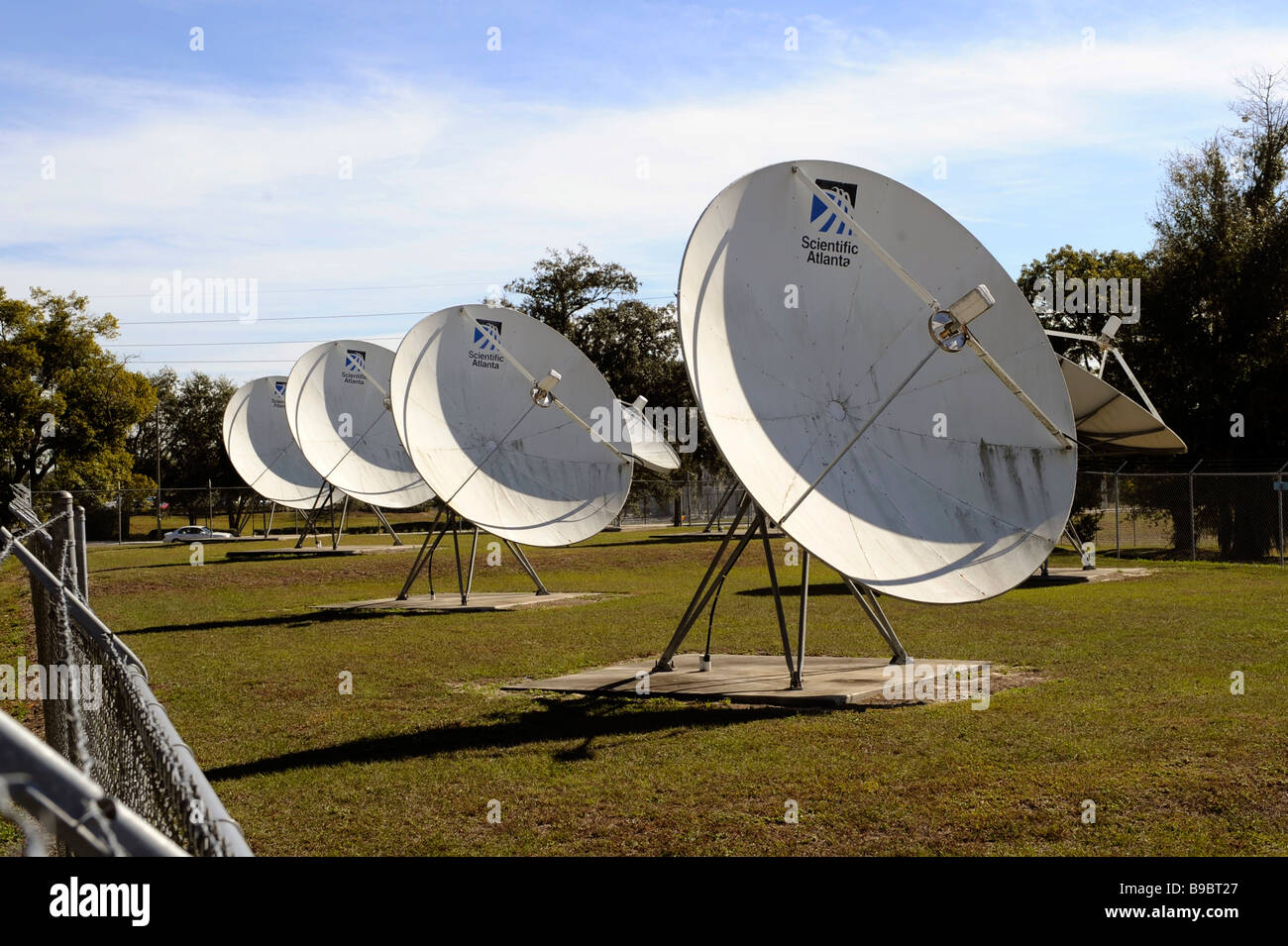 Satellite dishes transmit television signal to subscribers Stock Photo