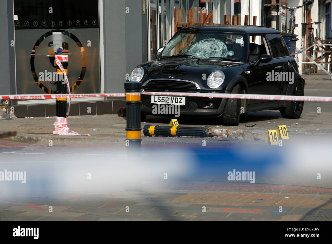 A road traffic accident leaves a car on the pavement on Clapham Hight Street, south London. Stock Photo