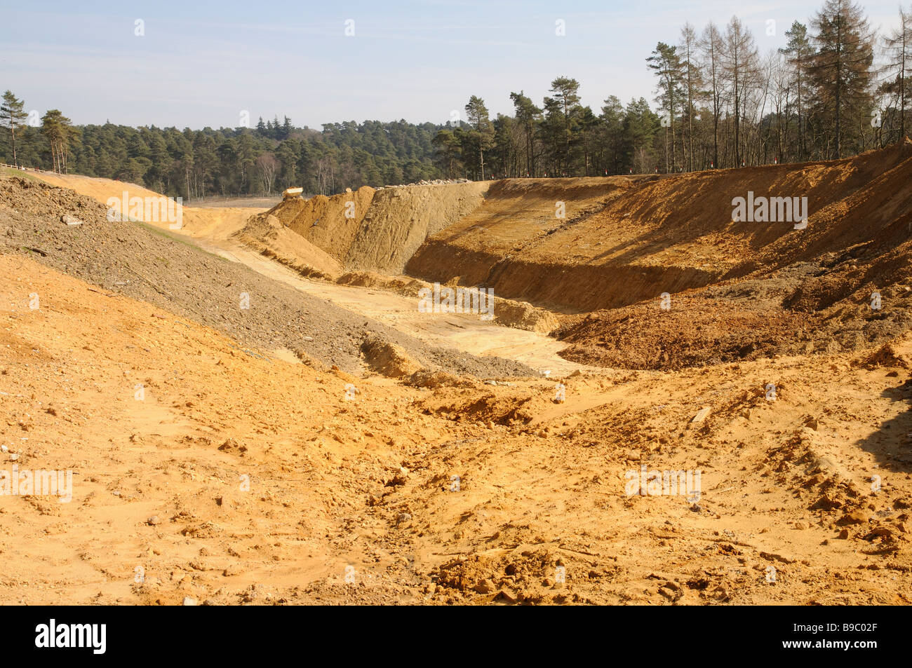 Piles of sand from the construction of twin tunnels on the A3 road at