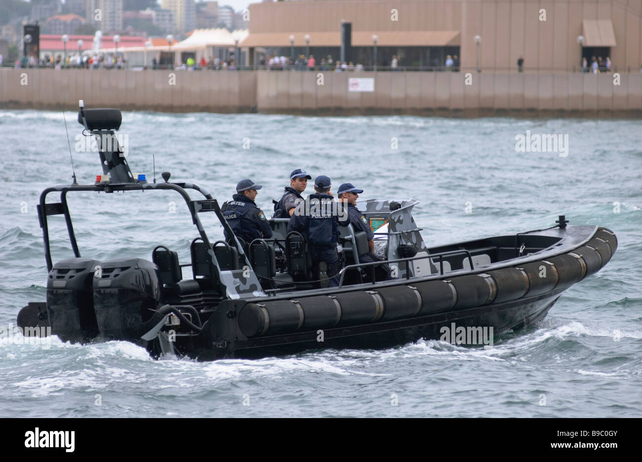 Police RHIB (Rigid Hull Inflatable Boat) provides security during a