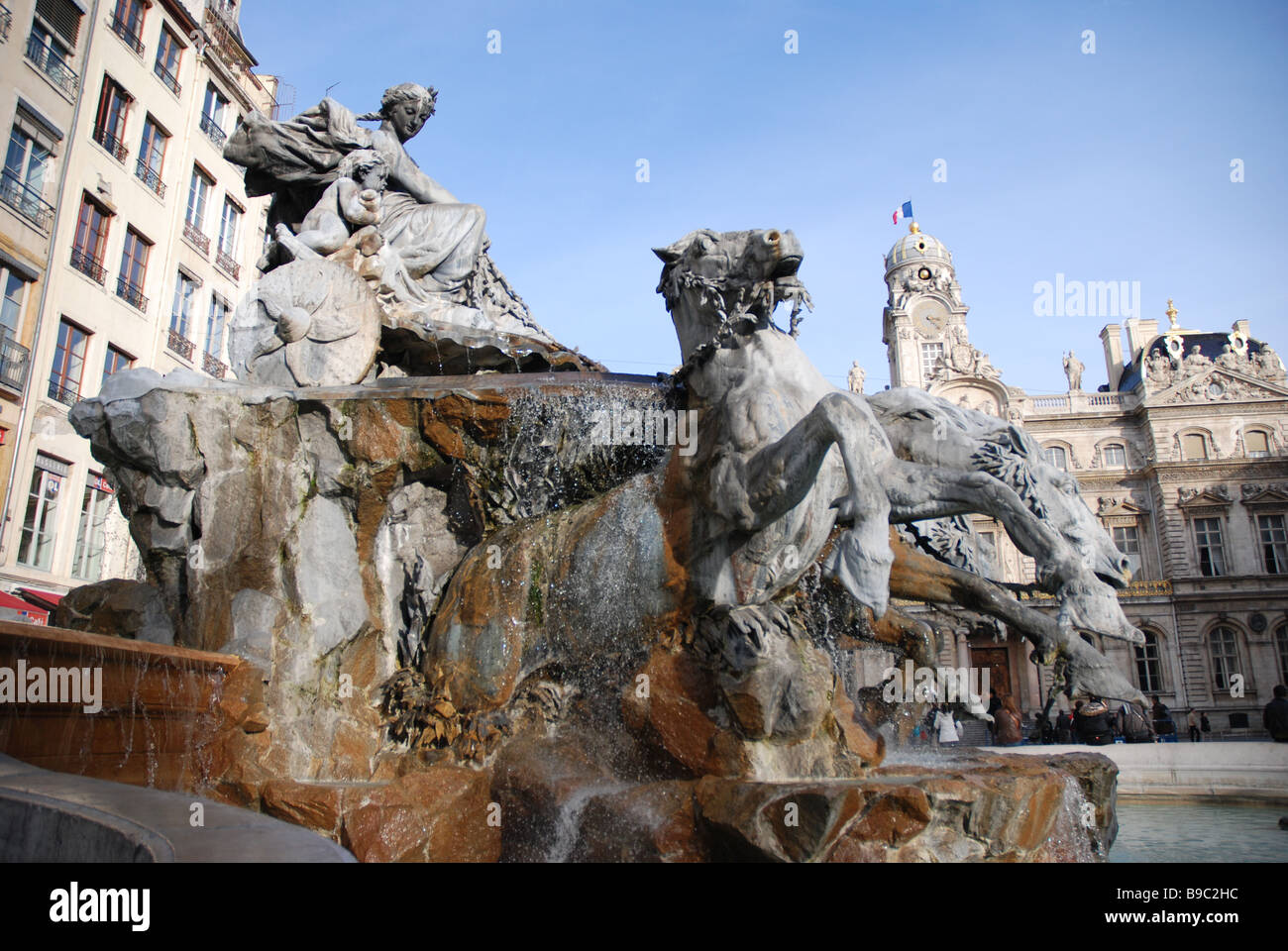 A fountain featuring a female chariot driver and four horses in Lyon France Stock Photo