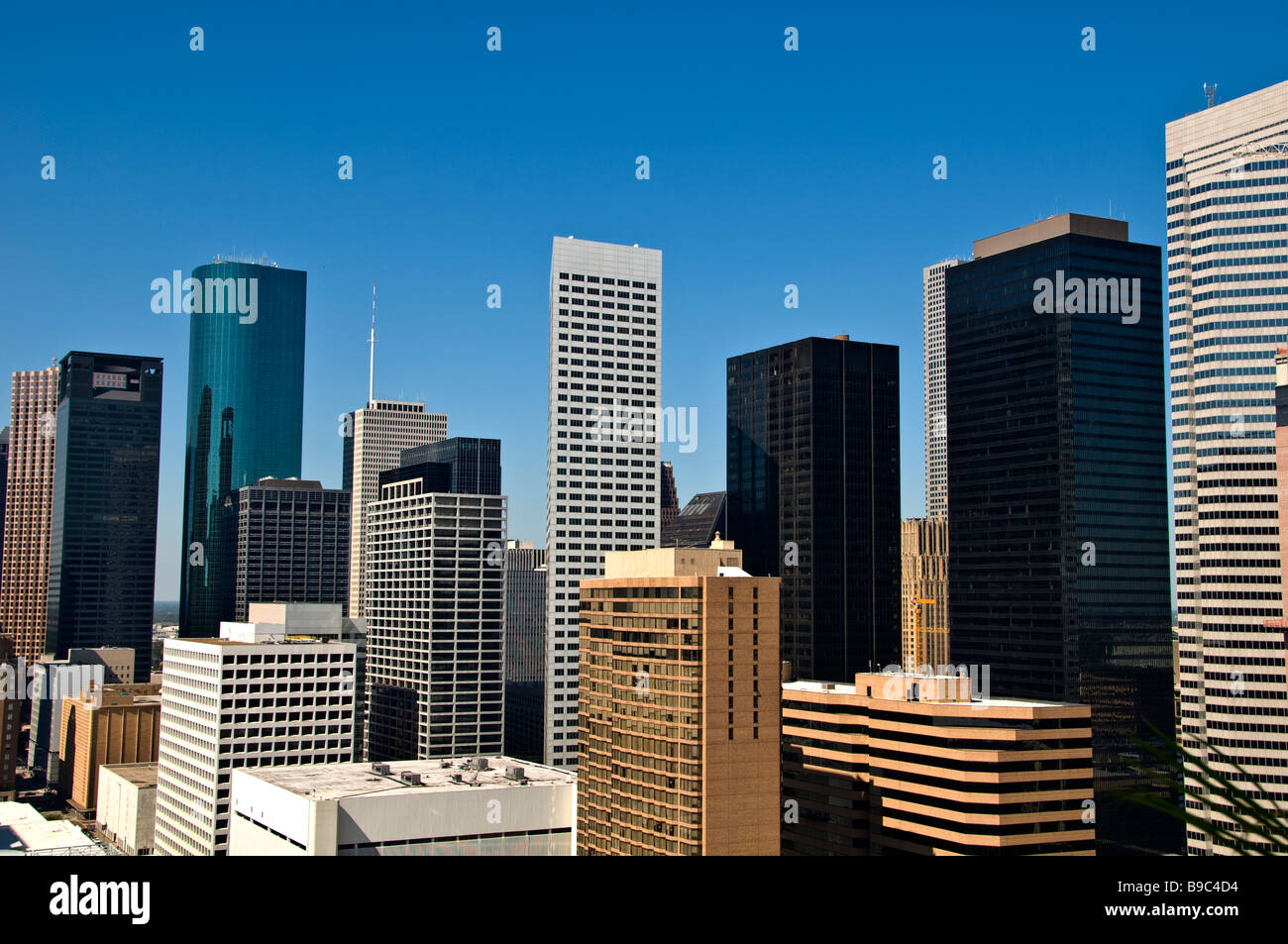 Houston Texas tx skyline skyscrapers buildings against clear blue sky downtown Stock Photo