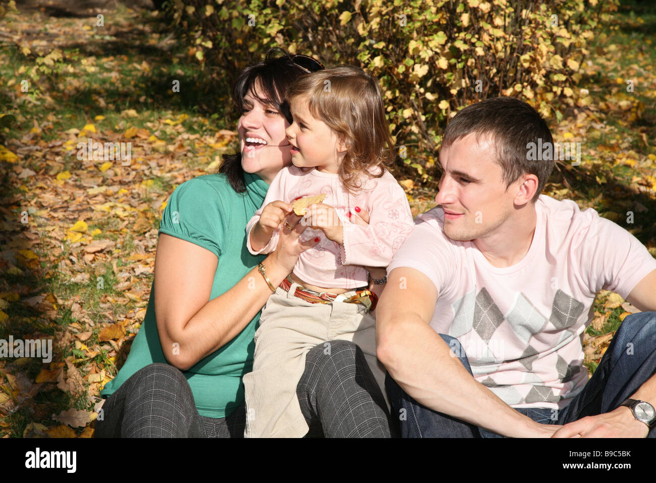 happy family in the park in autumn 2 Stock Photo - Alamy
