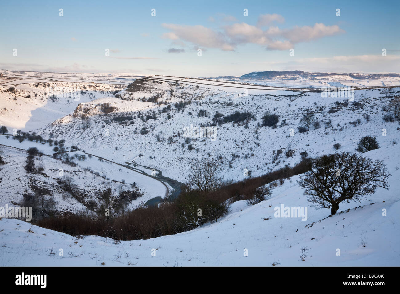 Early morning in Cressbrook Dale after a fall of snow, Peak District, Derbyshire Stock Photo