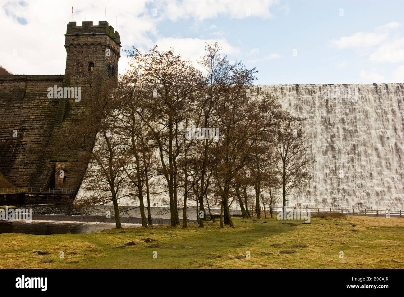 Derwent Dam with water cascading over the dam face Stock Photo