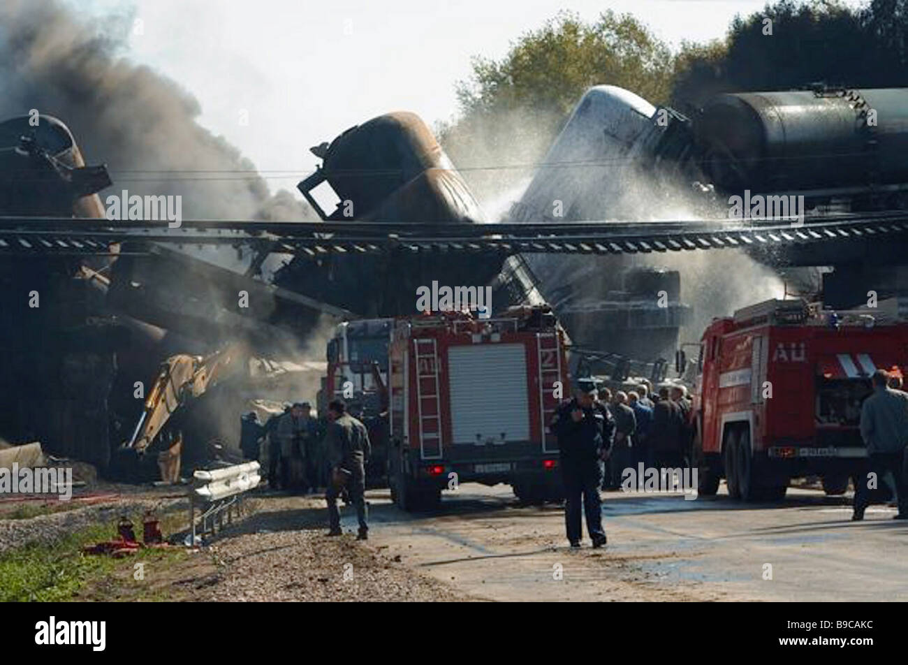 The fire service officers putting out fire in tank cars after the