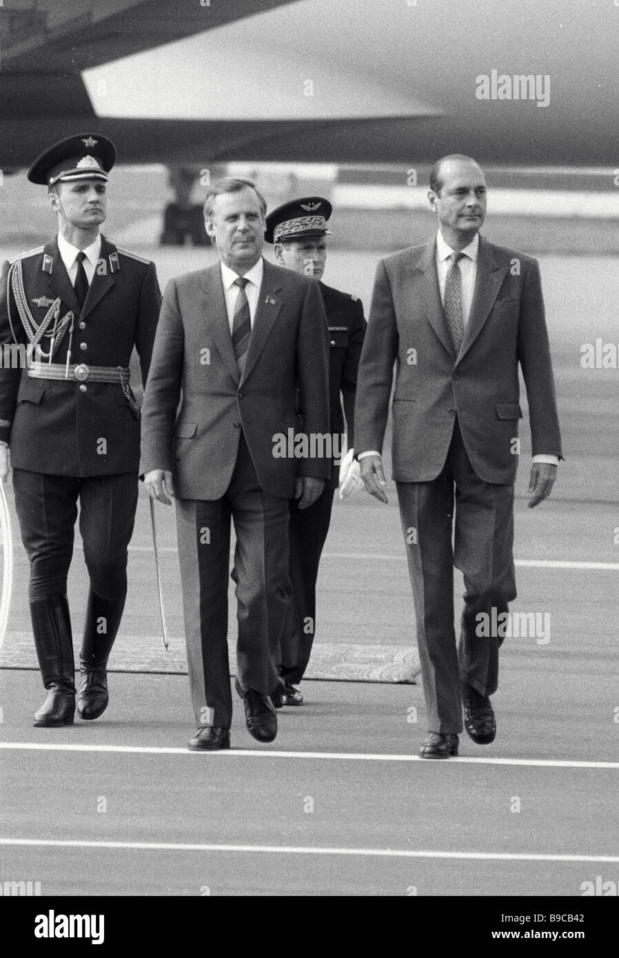 U S S R Council of Ministers Chairman Nikolai Ryzhkov center and French Prime Minister Jacques Chirac at Vnukovo Airport Moscow Stock Photo