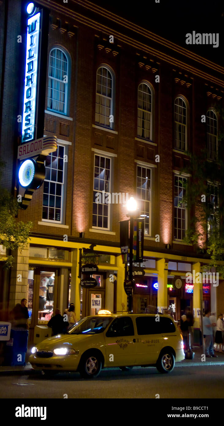 Taxi Wildhorse Saloon lit at night in entertainment district off lower