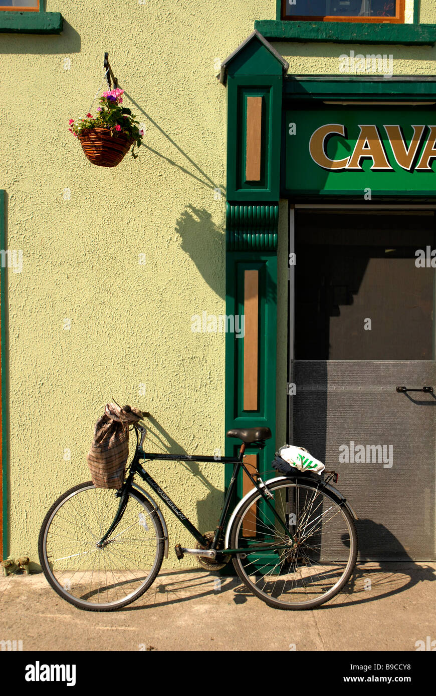 Bike parked outside shop in Easkey county Sligo Stock Photo