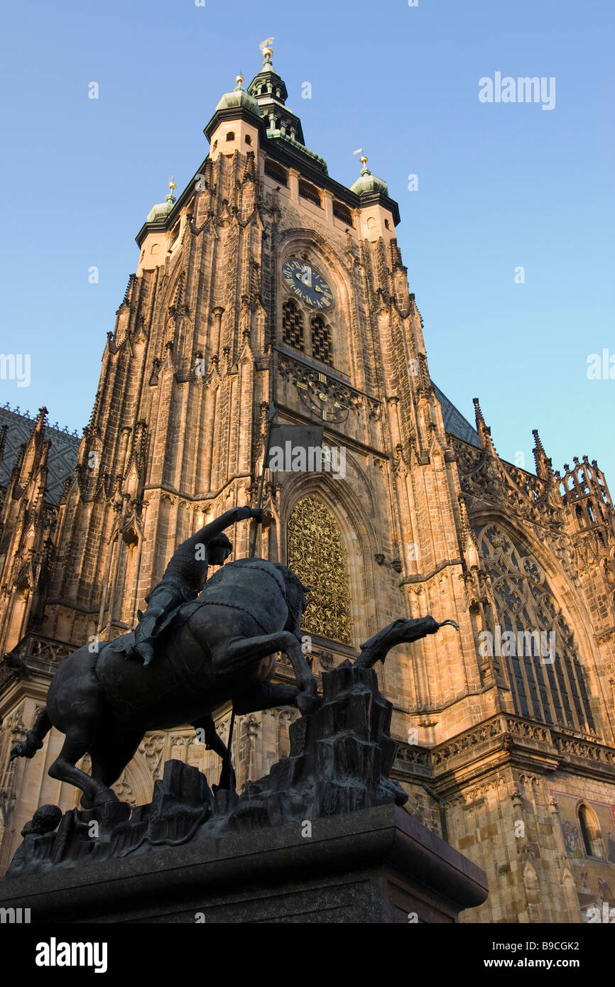 View of St.Vitus cathedral main tower with equestrian monument of St George in courtyard of Prague castle, Czech republic. Stock Photo