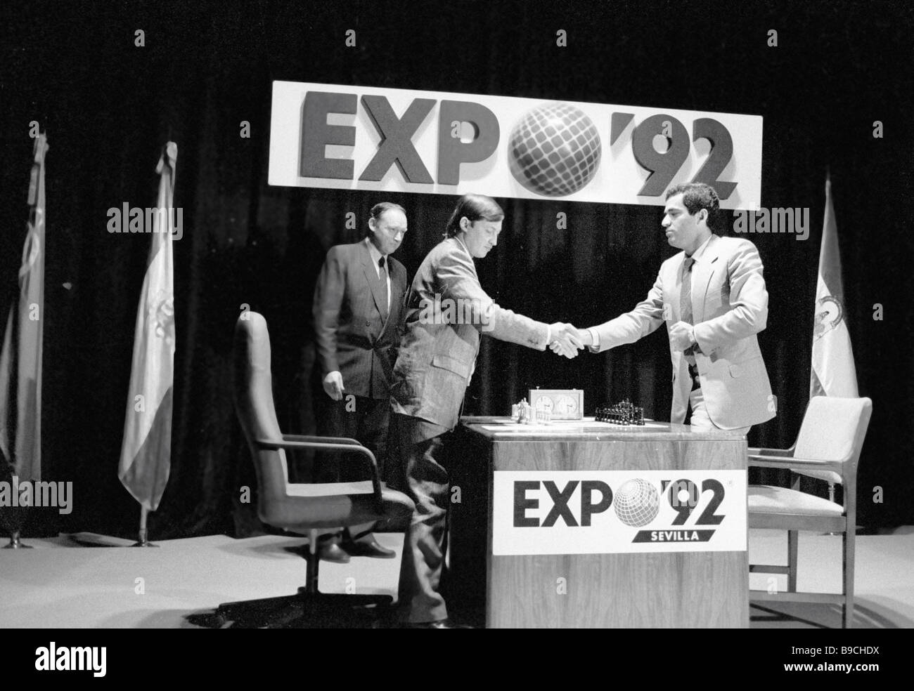 Former World Chess Champion, Garry Kasparov, right, talks to the media as  FIDE presidential candidate and former World Chess Champion, Anatoly Karpov,  left, and President of English Chess Federation, CJ de Mooi listen on  during their World Chess