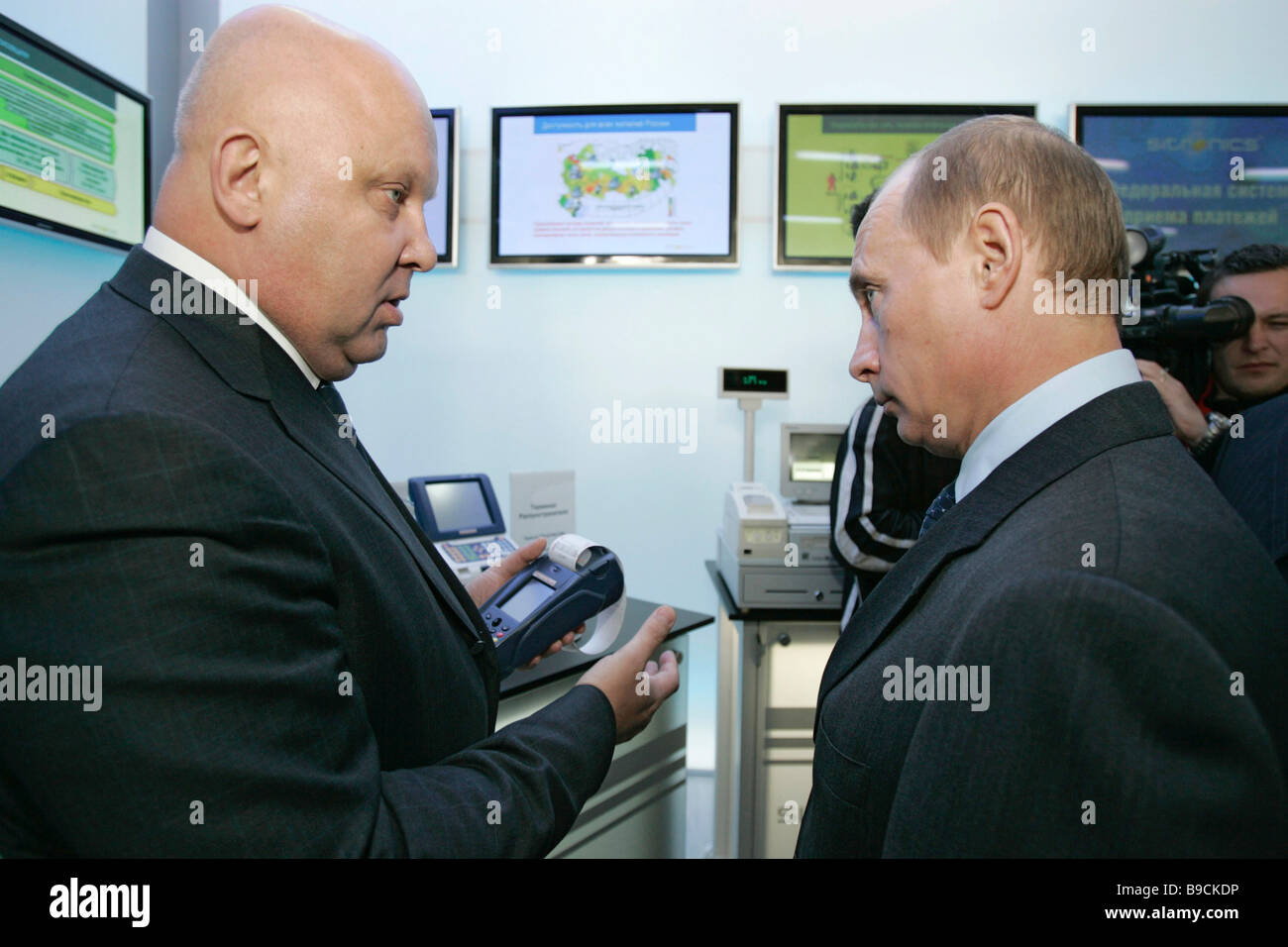 Russian President Vladimir Putin left and Alexander Goncharuk Sistema government company CEO visit a Citronics concern Stock Photo