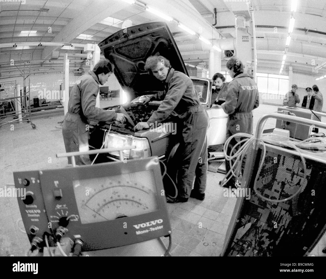 VOLVO service station mechanics check the engine Stock Photo Alamy
