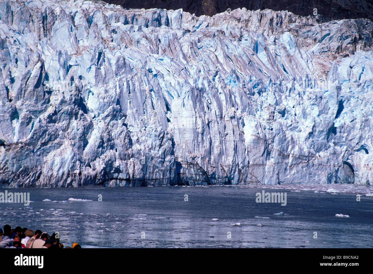 Alaska cruise ship Glacier Bay cruise ship passengers view large huge blue ice glacier cold Stock Photo