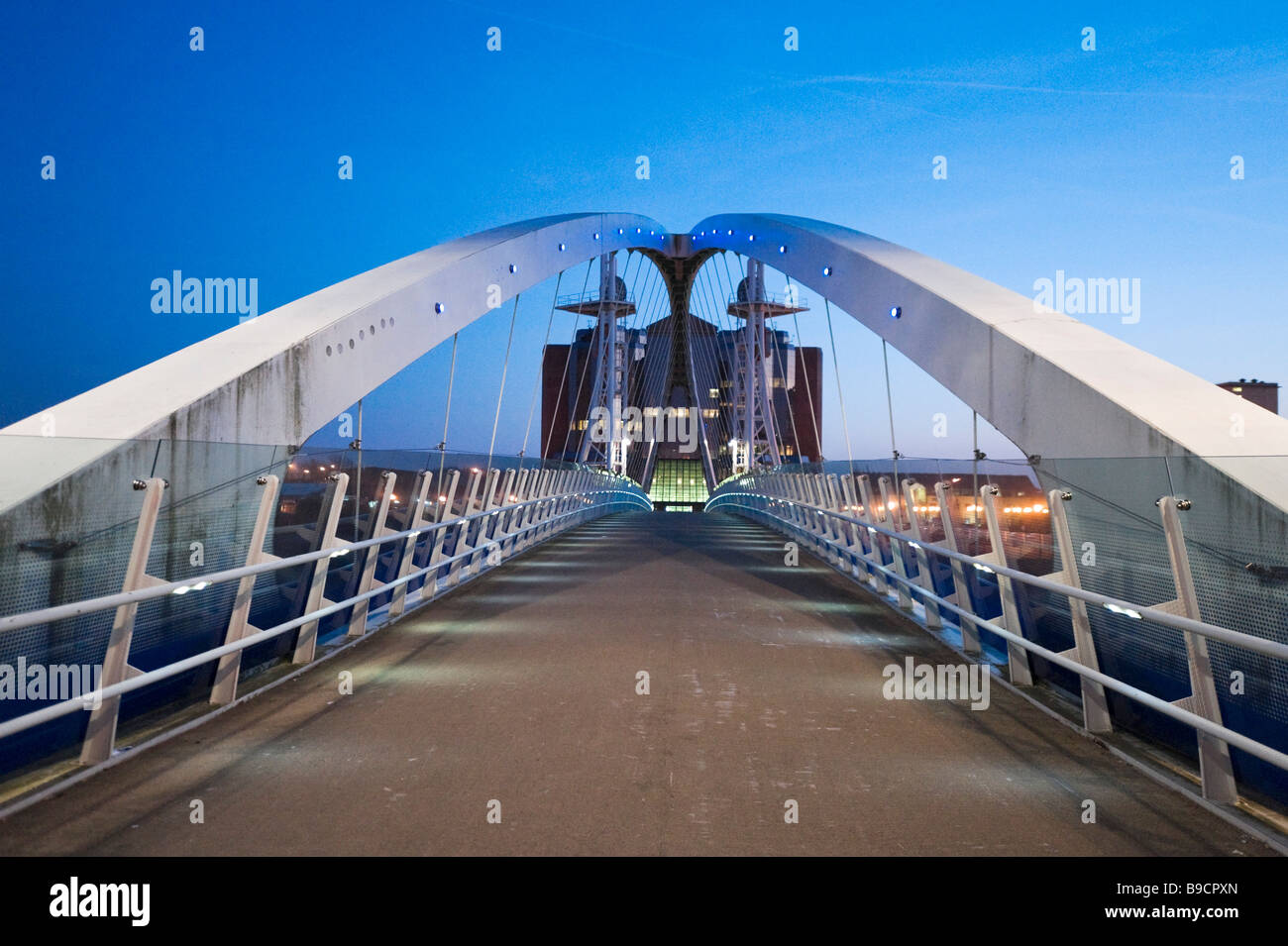 The Millennium lifting footbridge over the Manchester Ship Canal at night, Salford Quays, Greater Manchester, England Stock Photo