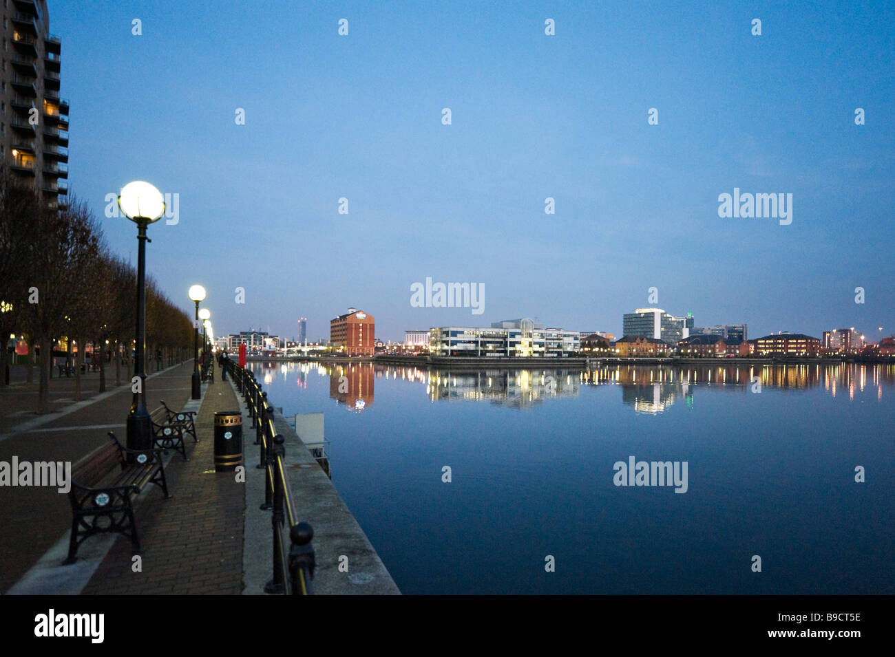 The promenade alongside the Manchester Ship Canal at dusk, Salford Quays, Greater Manchester, England Stock Photo