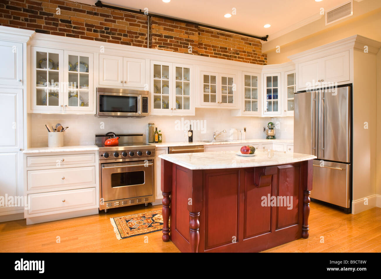 Traditional kitchen with red island Stock Photo Alamy