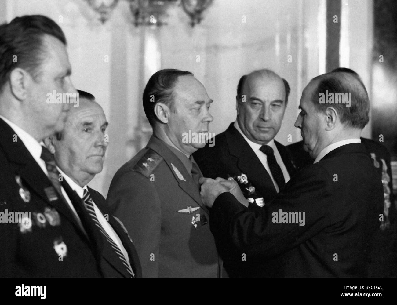 French president Francois Mitterrand right presenting air regiment