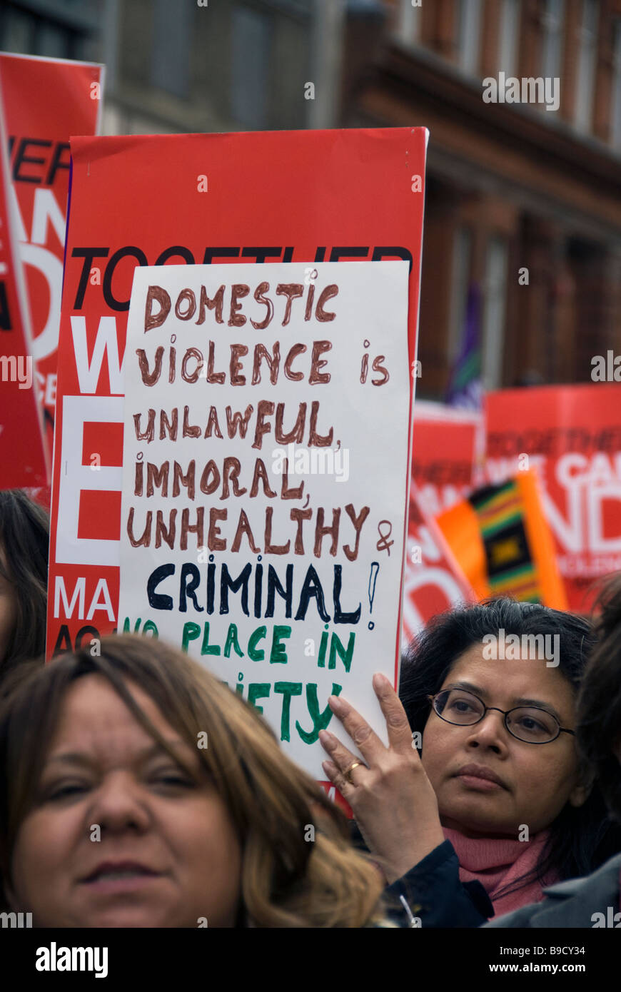 Women's protest through central London against domestic violence Stock Photo