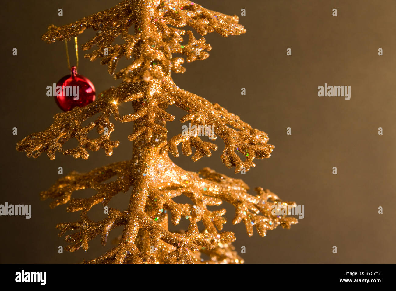 Glittering Christmas tree with red ornament Stock Photo Alamy