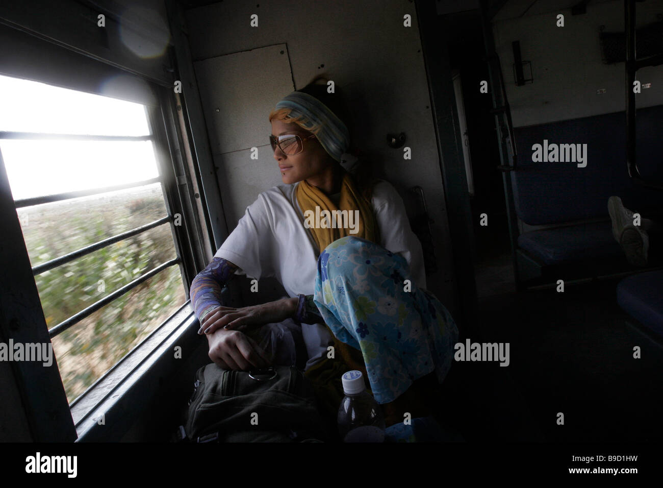 A female tourist travel by train in Rajasthan in India Stock Photo