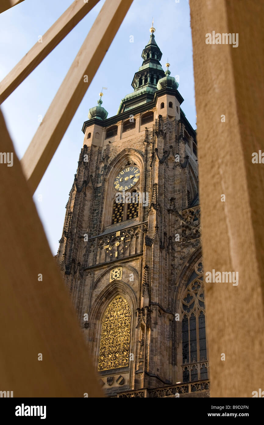 View of St.Vitus cathedral main tower through wooden scaffold, Prague castle, Czech republic. Stock Photo