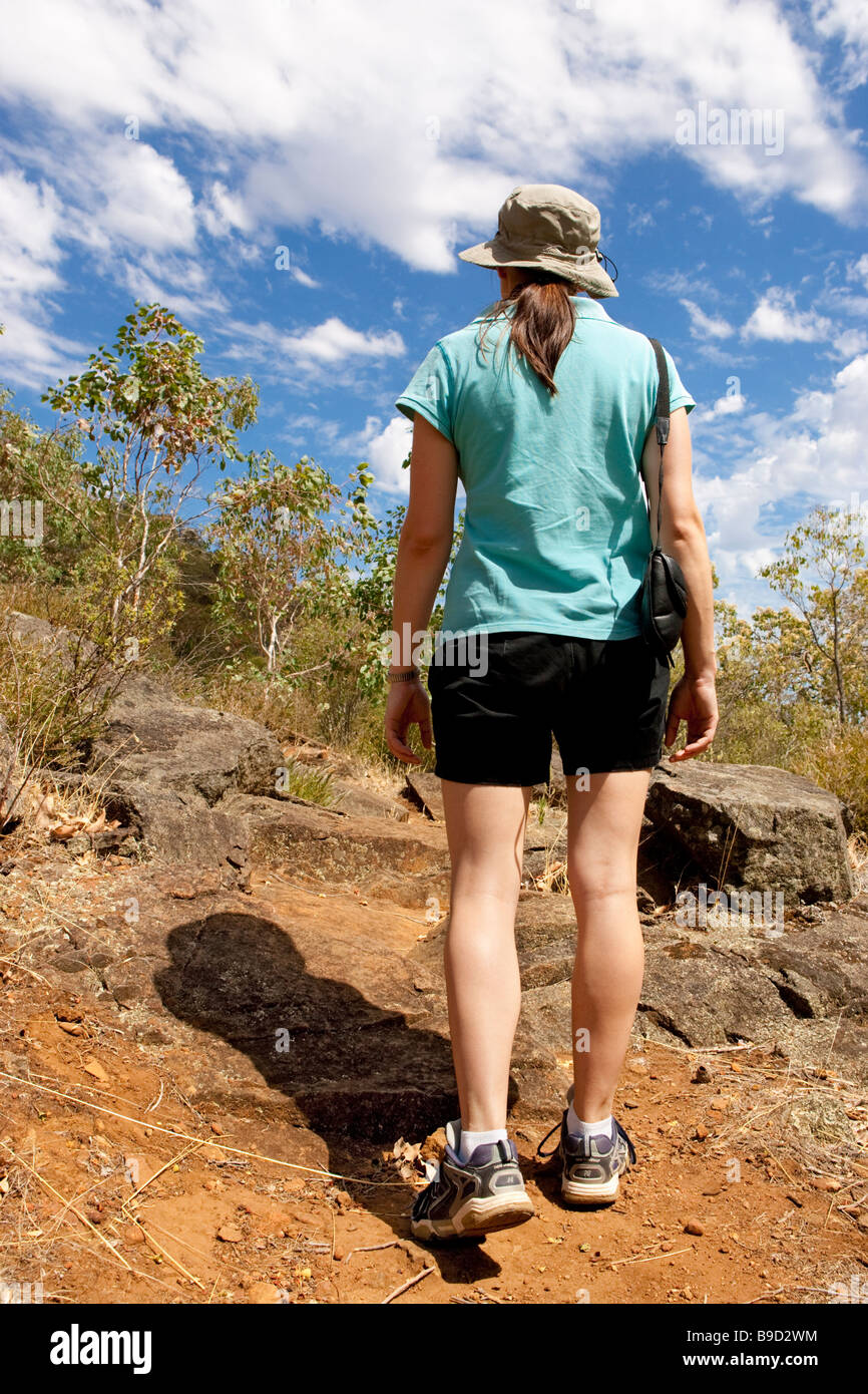 A young woman walking through Australian bushland. Serpentine National park, Perth, Western Australia Stock Photo