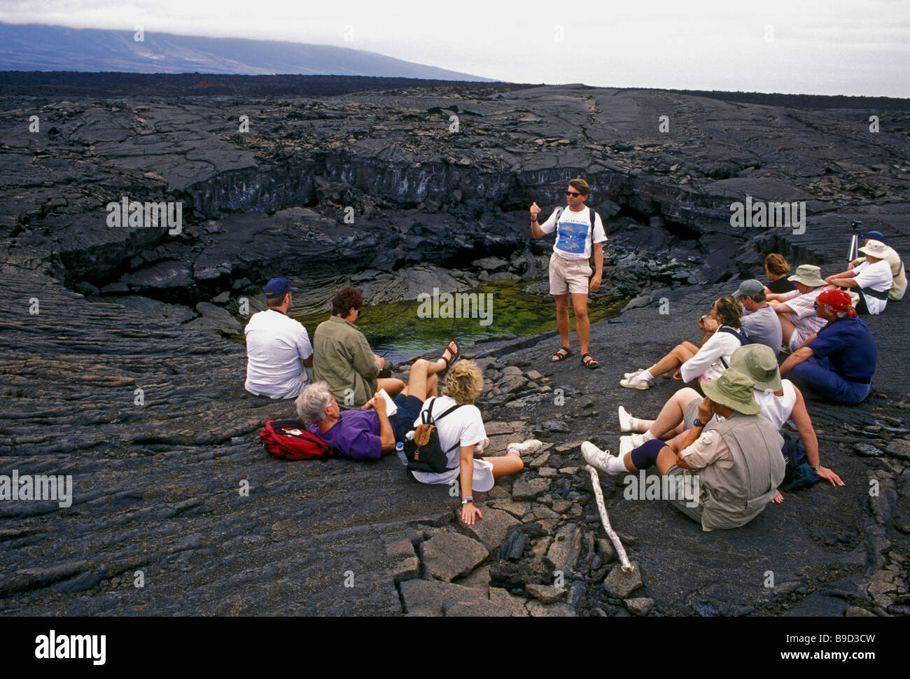 guided tour, tour group, pahoehoe lava, Fernandina Island, Narborough Island, Galapagos Province, Galapagos Islands, Ecuador Stock Photo