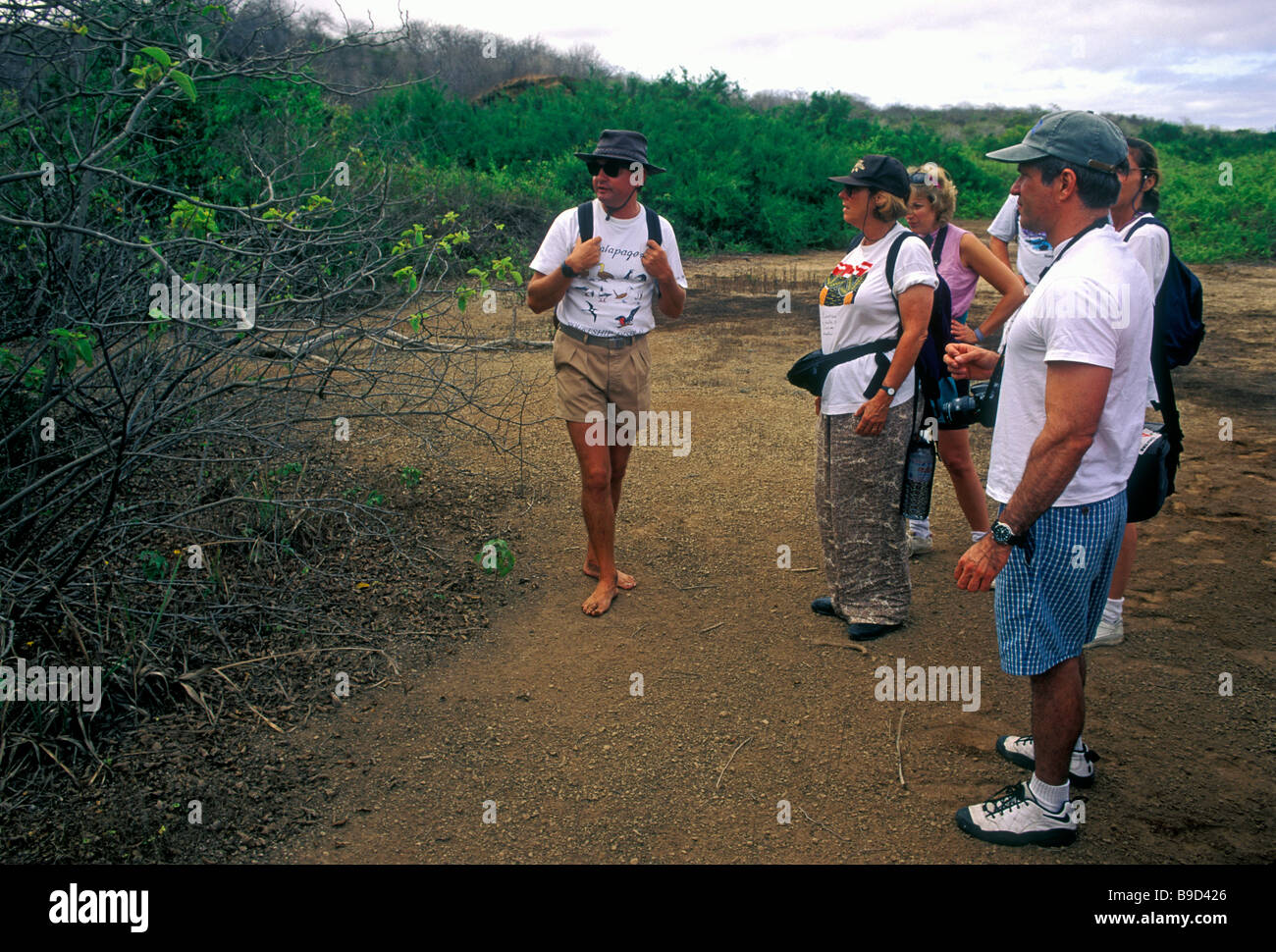 naturalist, tourists, tour group, Isabela Island, Albemarle Island, Galapagos Islands, Ecuador, South America Stock Photo