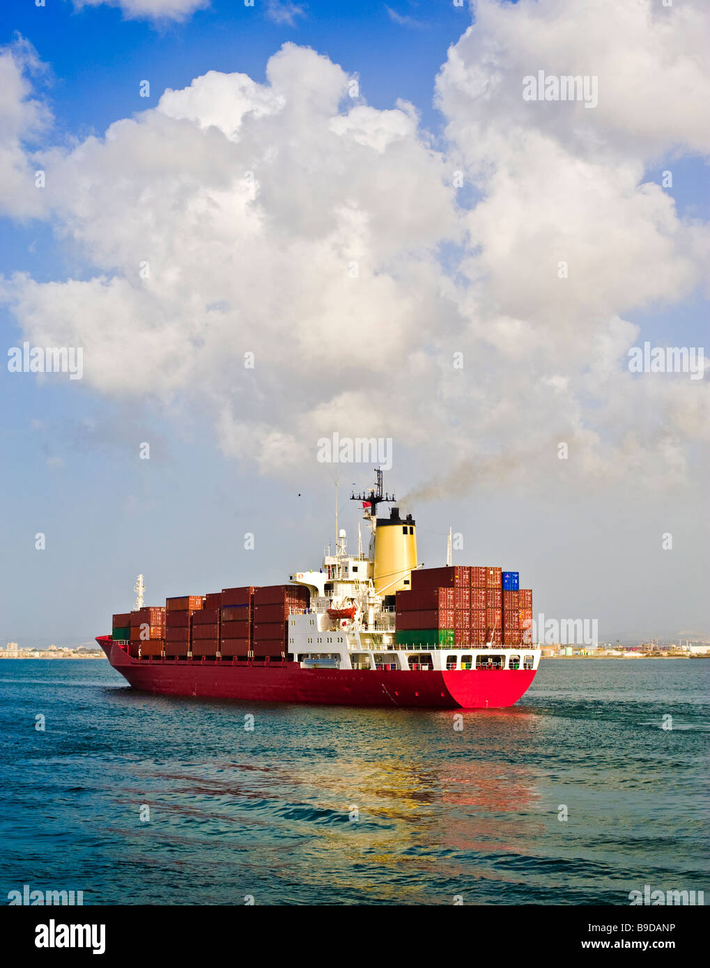 fully loaded cargo ship leaving the port Stock Photo Alamy