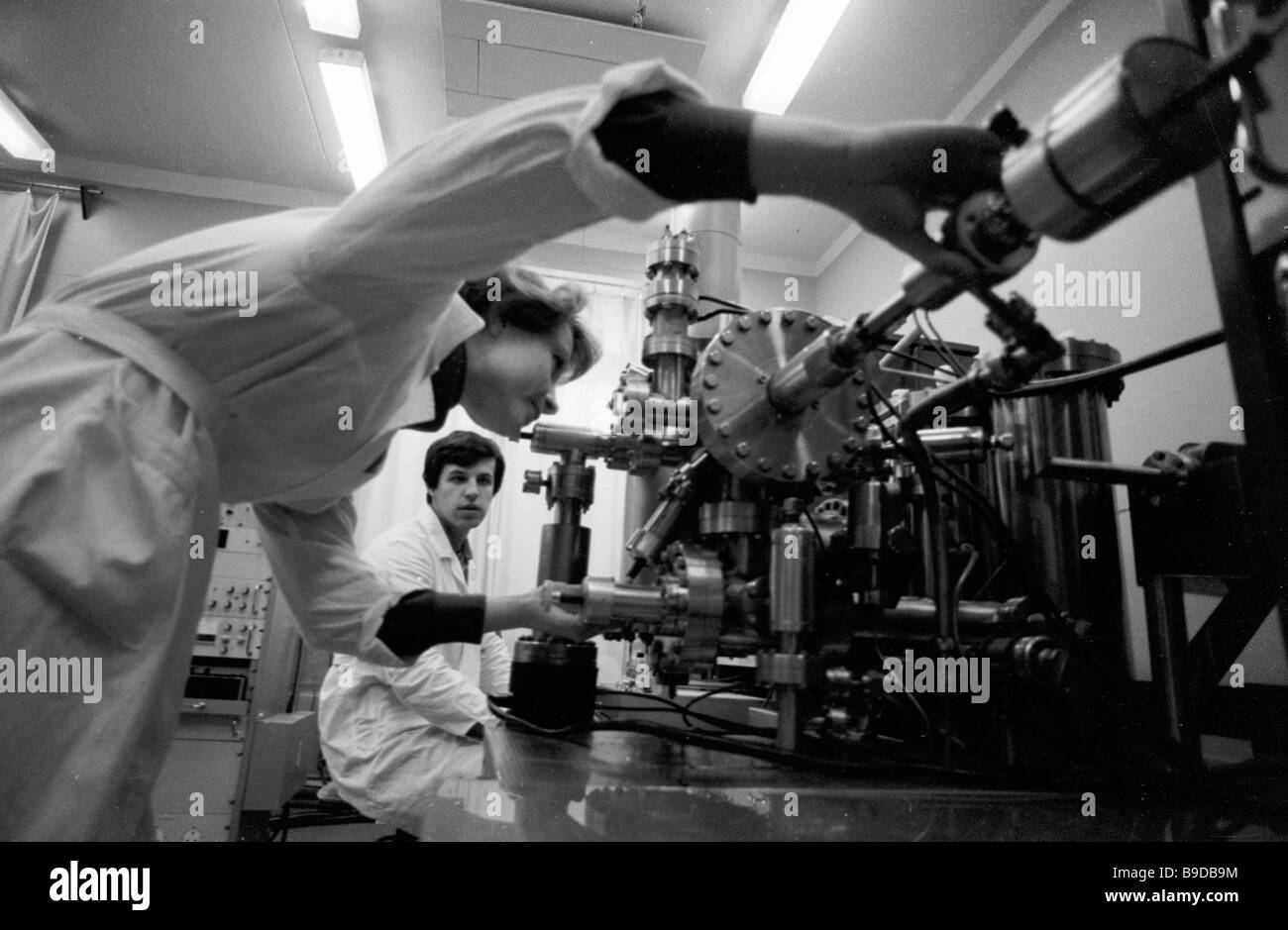 Researchers carrying out a routine experiment at the laboratory of ...