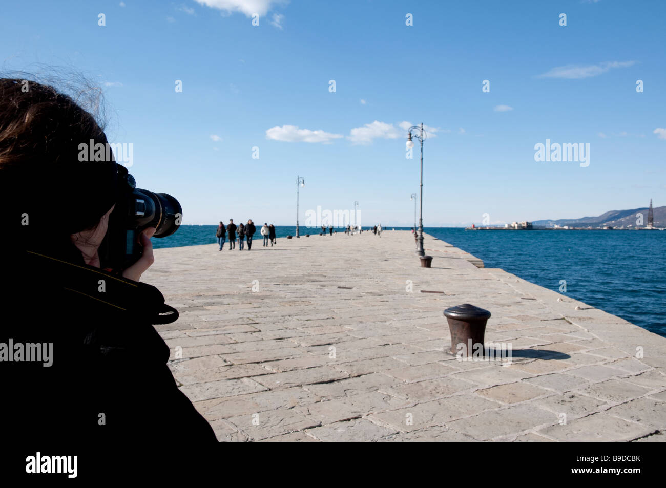 Photographer is taking picture at Trieste Molo Audace Stock Photo
