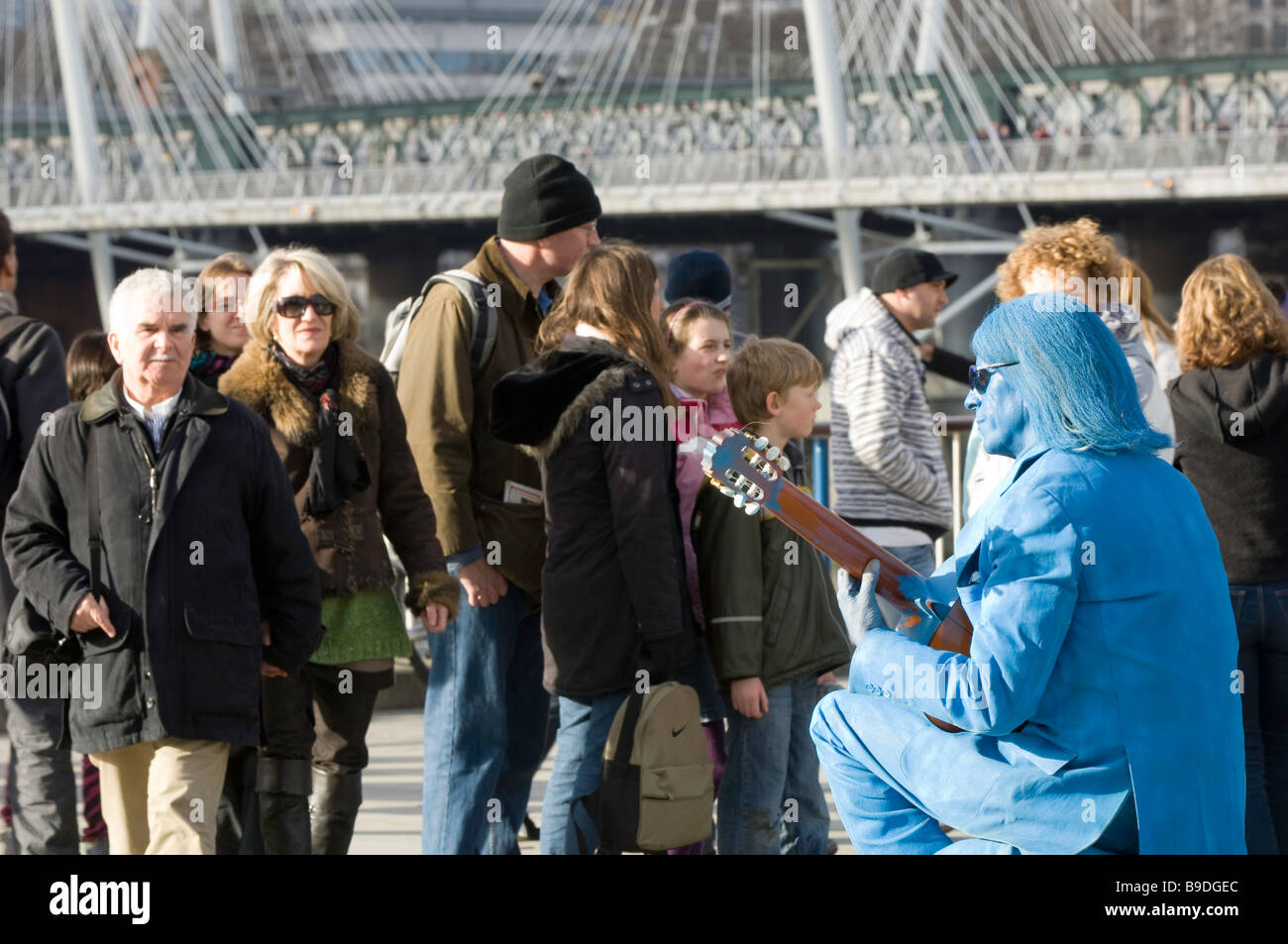 Busker on Southbank and people London United Kingdom Stock Photo