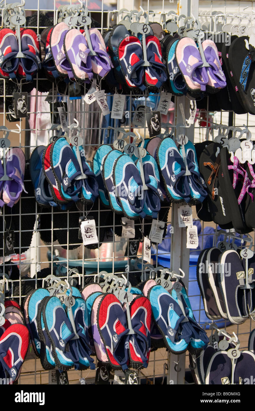 rack racks of Childrens Soft Beach Shoes Shoe Display at a Seafront ...