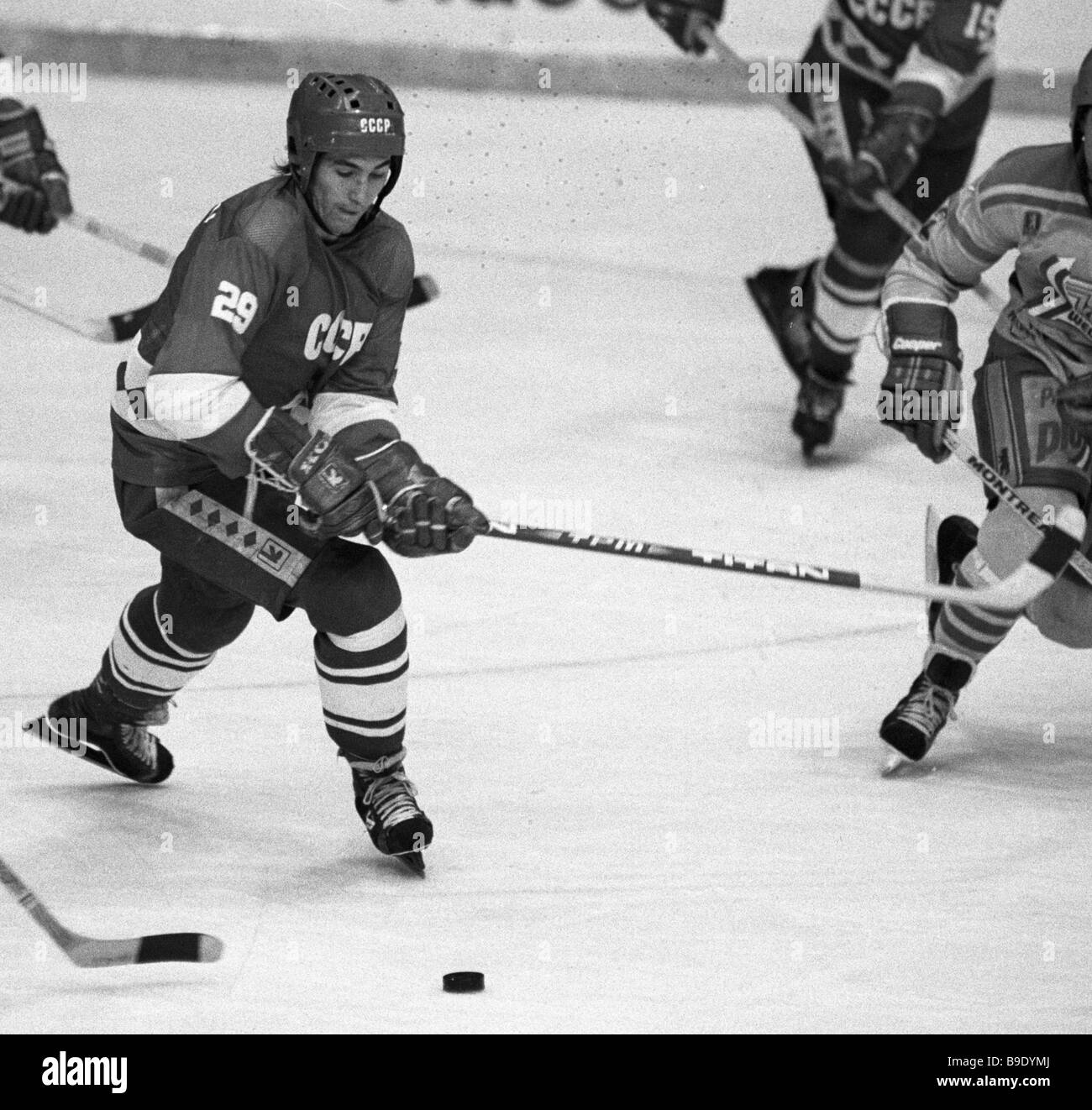 Ice hockey forward Alexander Kozhevnikov tries to snatch the puck