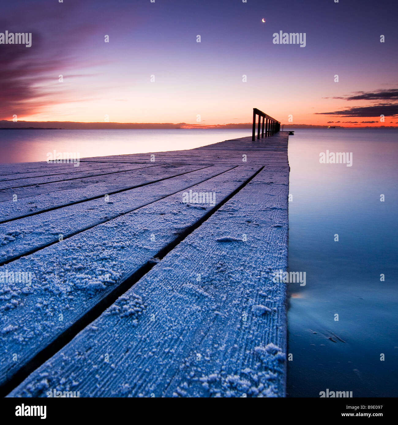 Early morning shot of a cold bathing jetty with frost. Stock Photo