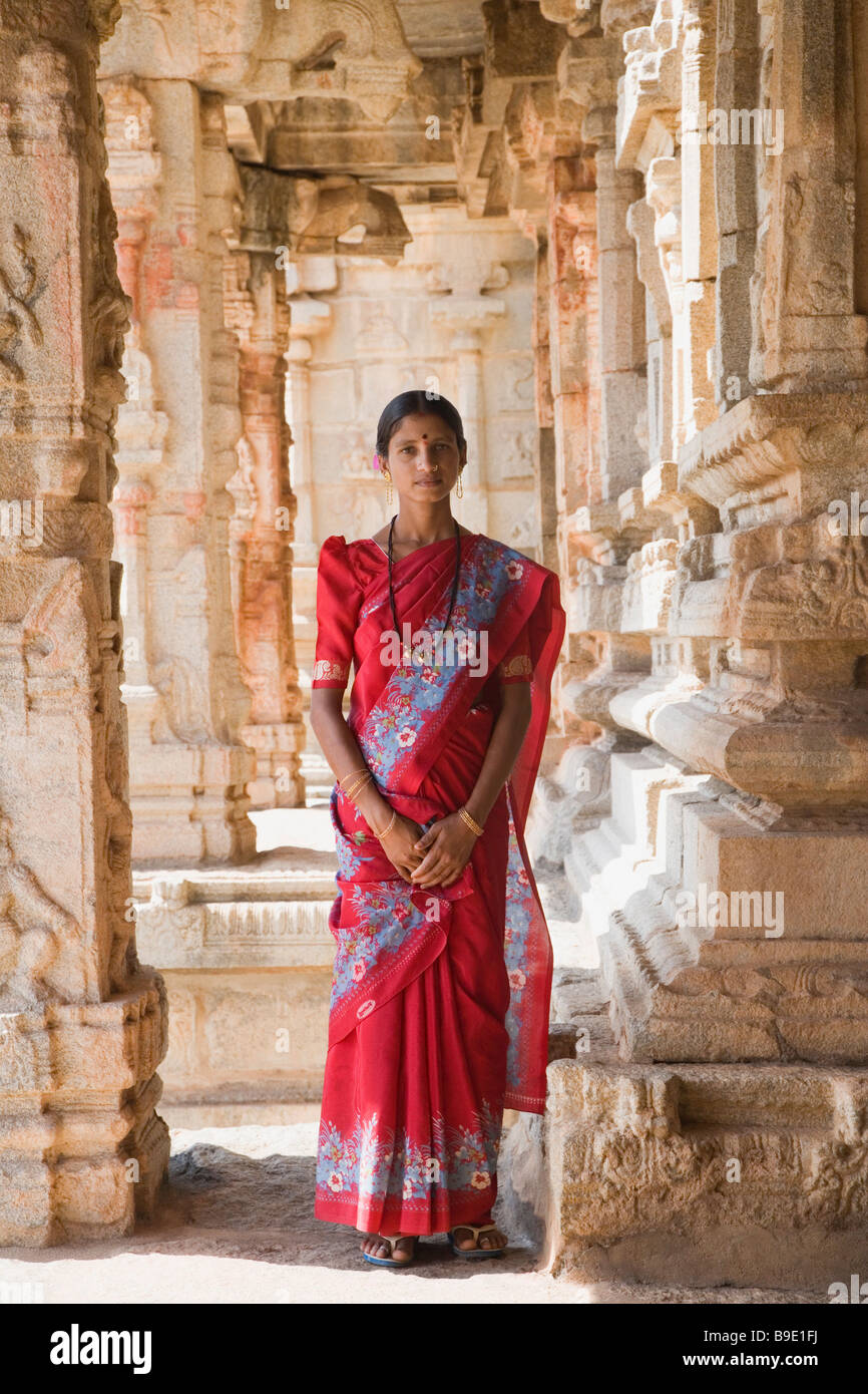 Woman standing in a temple, Krishna Temple, Hampi, Karnataka, India Stock Photo