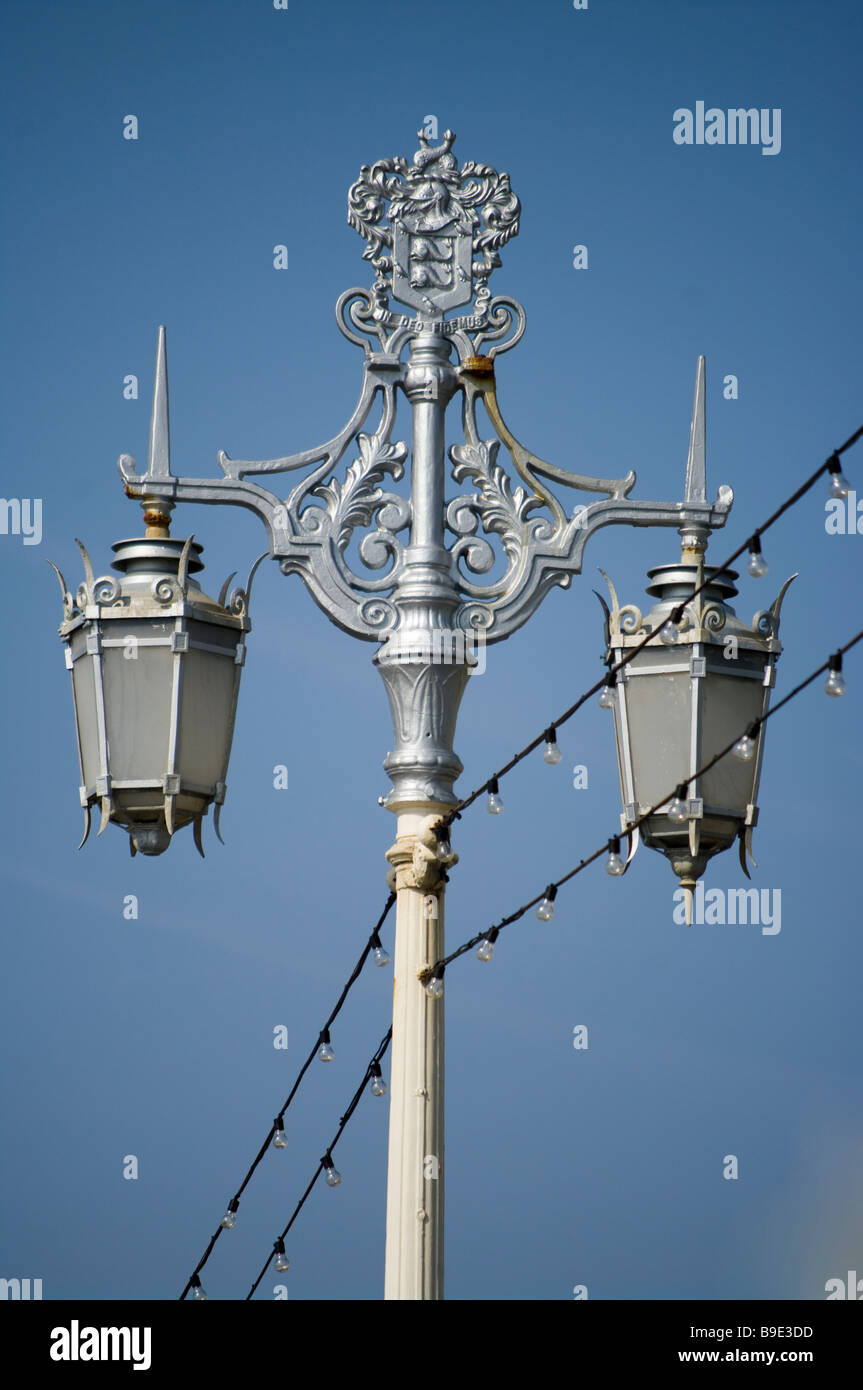 Ornate Metal Street Lamps lamppost lampposts Against a Blue Sky Stock Photo