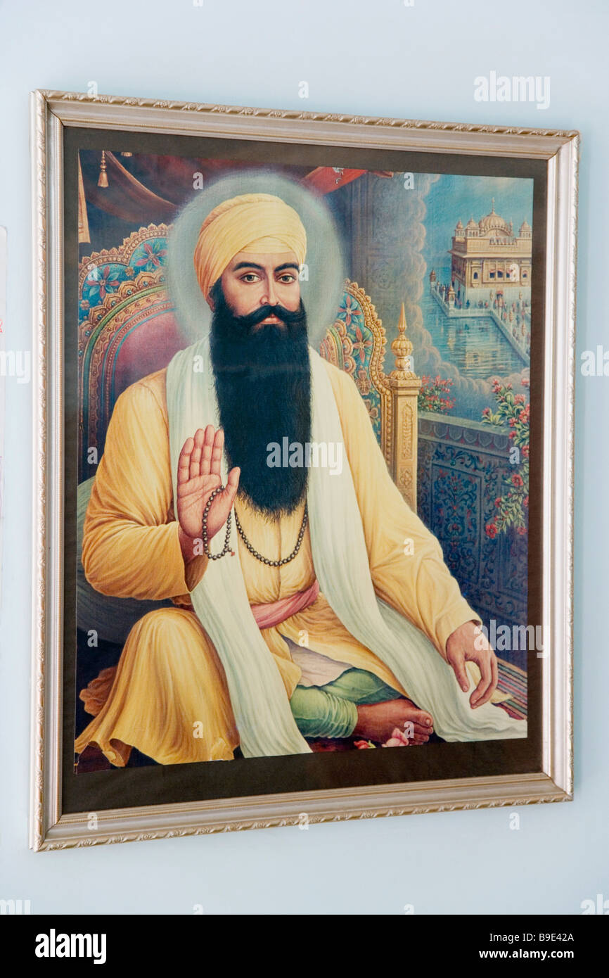 Picture of Guru Arjan Dev ji the fifth Sikh guru mounted on a wall, Golden Temple, Amritsar, Punjab, India Stock Photo
