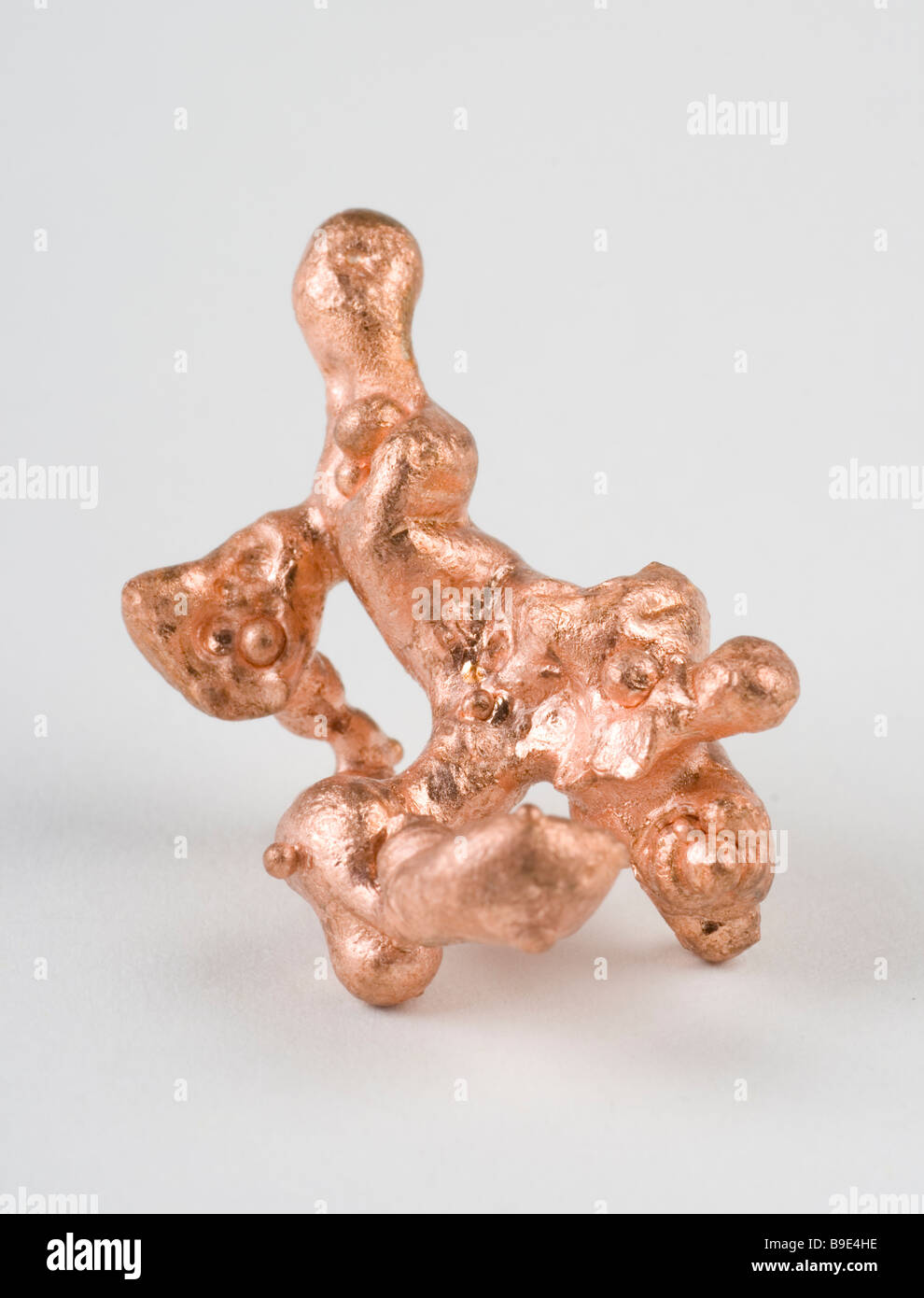 Copper (Cu) is one of the few metallic elements that is found in elemental form. Stock Photo