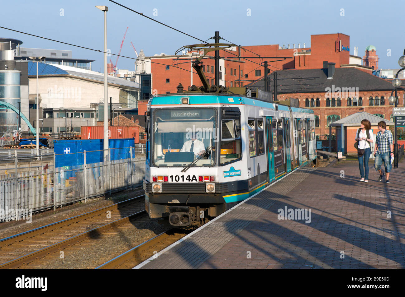 Metrolink tram at the G-Mex tram stop in the late afternoon, Manchester, England Stock Photo