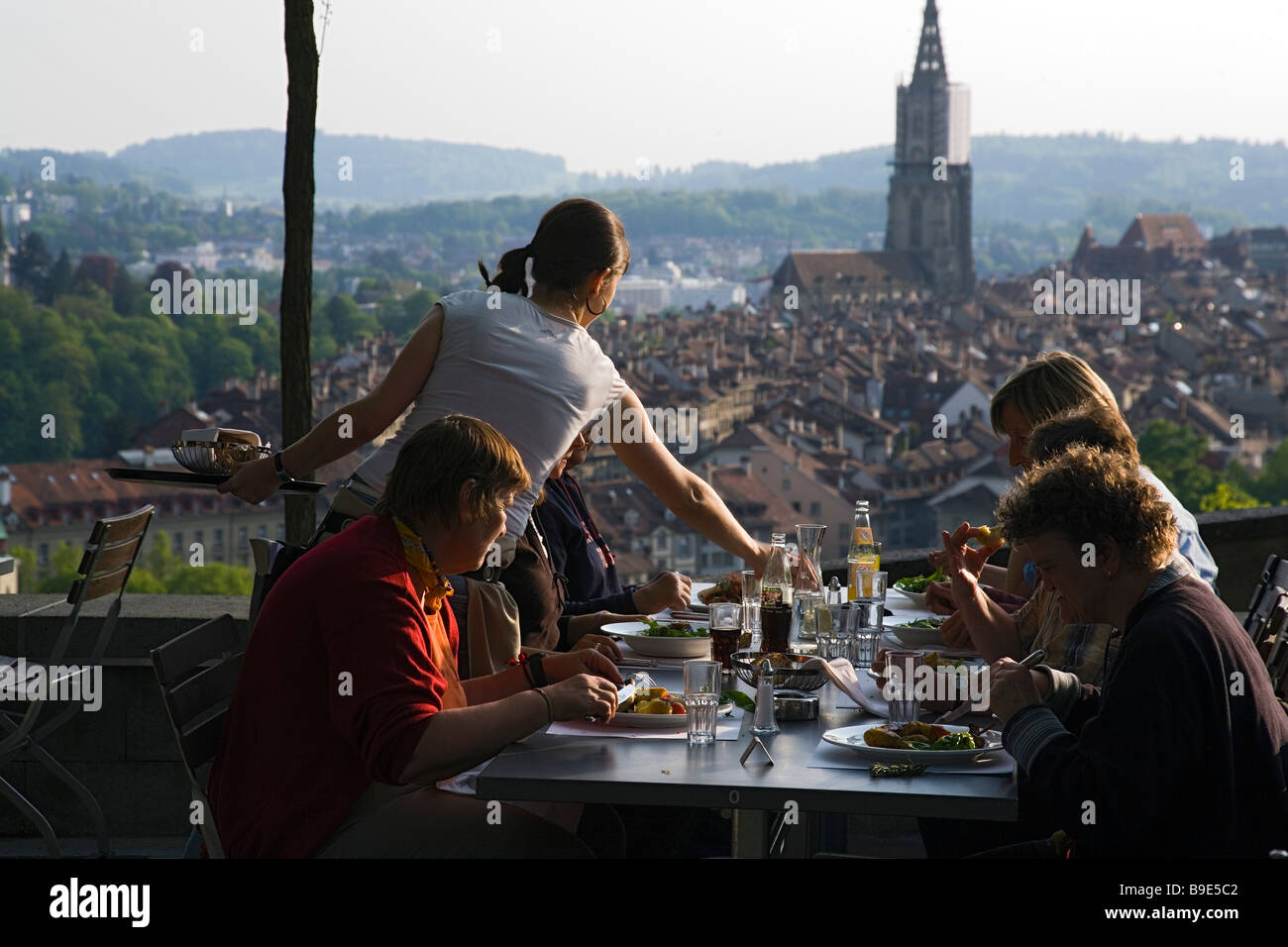Guests enjoying meal in a restaurant with view over Old Town Rosengarten Berne Canton of Berne Switzerland Stock Photo