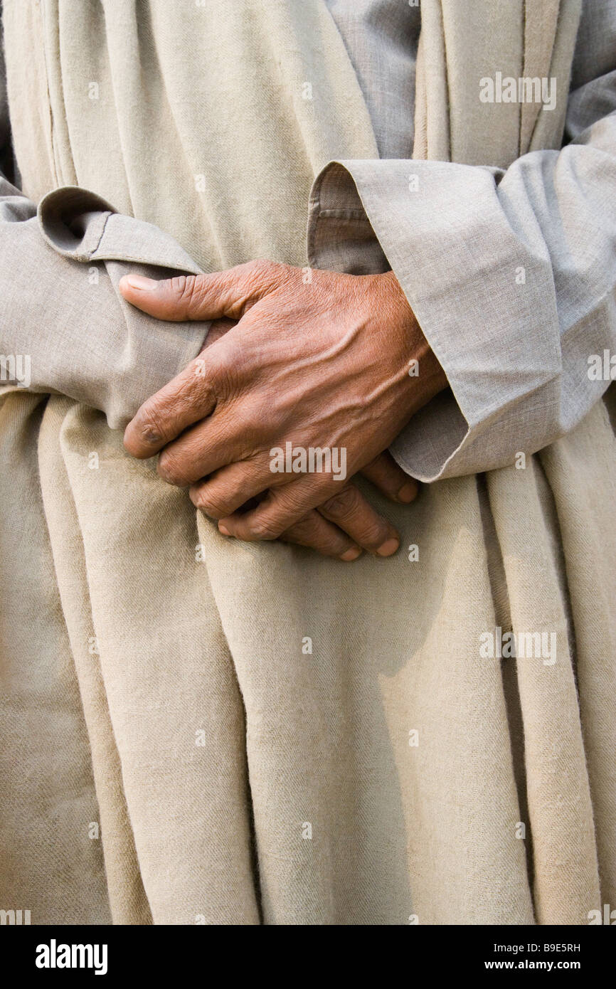 Mid section view of a man holding his hands, Varanasi, Uttar Pradesh, India Stock Photo