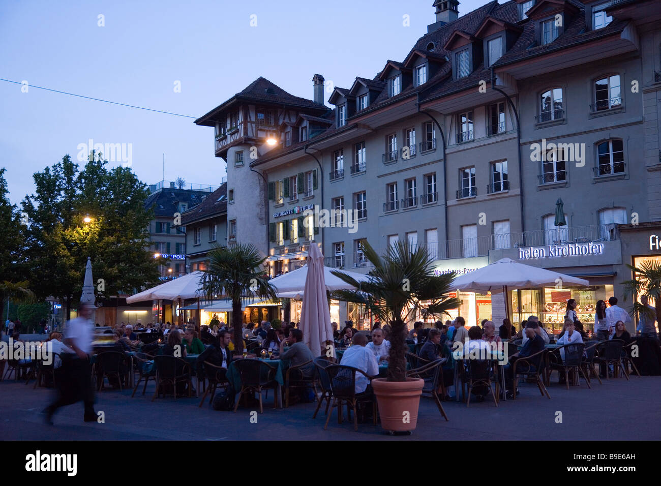 Guests sitting in pavement cafes at Bärenplatz in the evening Old Town Berne Canton of Berne Switzerland Stock Photo