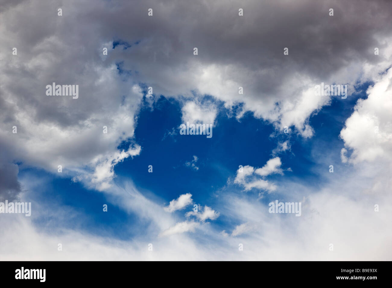 White puffy clouds on a Colorado blue sky day Stock Photo
