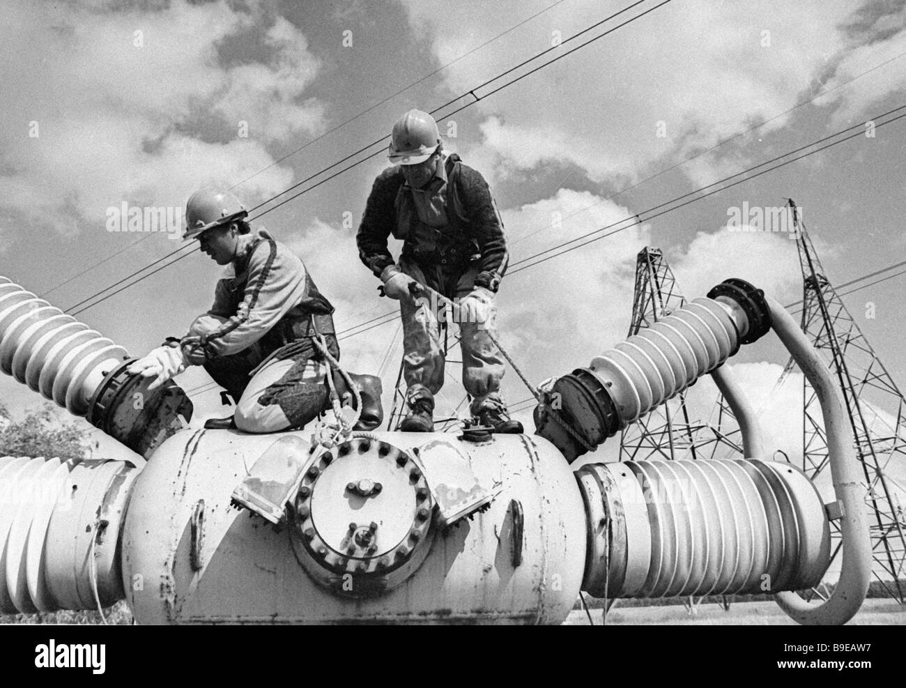 Repairing a power transmission line Stock Photo Alamy