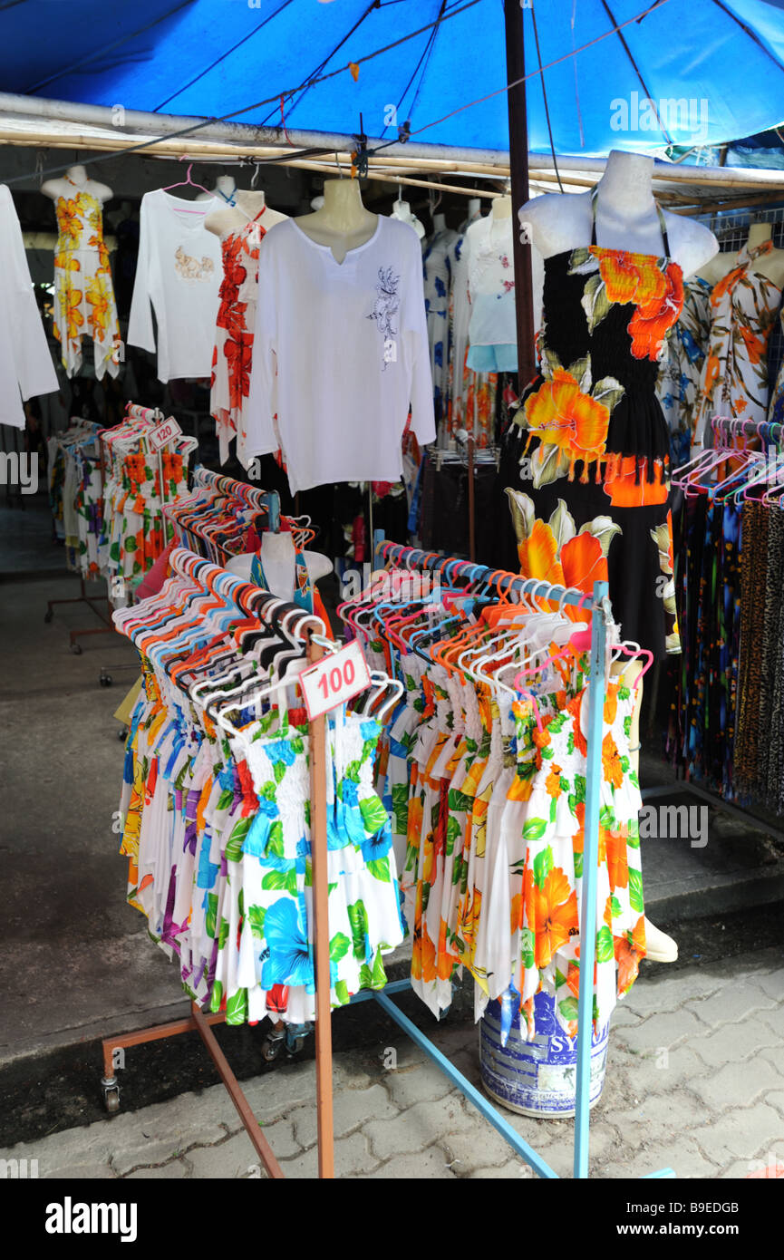 Tourist clothing in an outdoor shop in the grounds of  Wat Chalong Budhist temple in Phuket Thailand Stock Photo