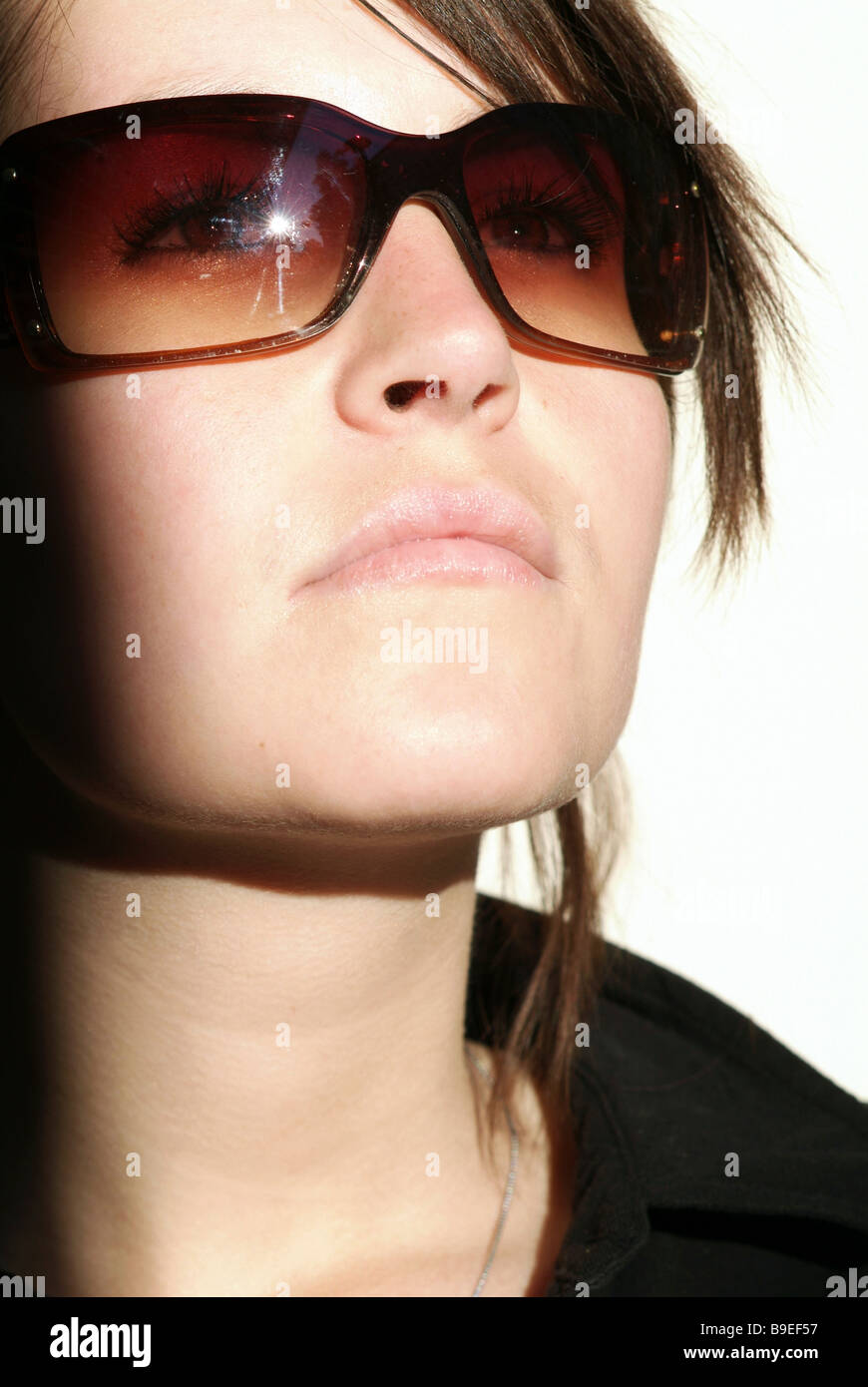 Portrait of a young woman in sunglasses Stock Photo - Alamy