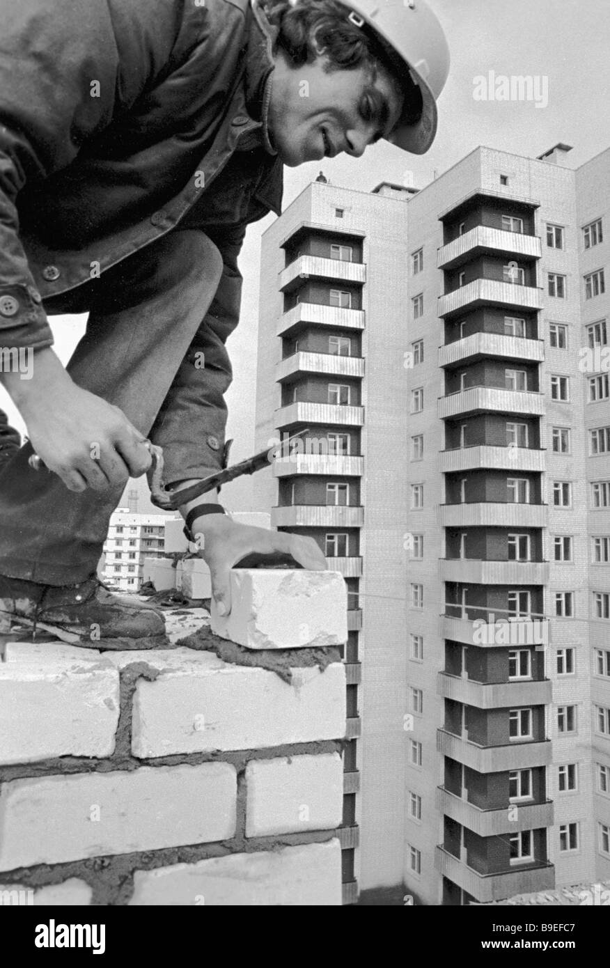 A bricklayer working on the new block construction site in