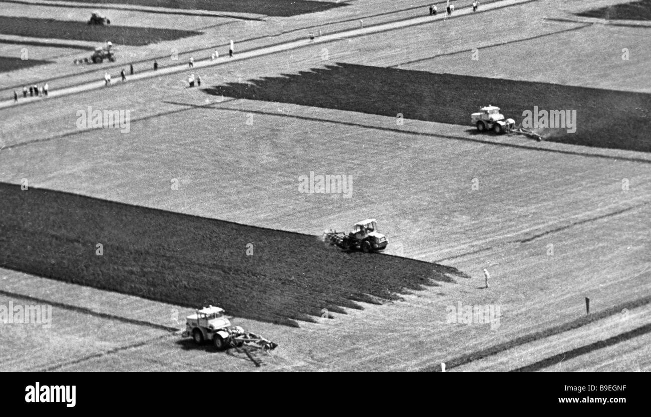 Tractor drivers plough up field during second international competition